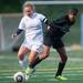 Huron's Chea Rael-Whitsitt and Skyline's Mackenzie Stites  fight for the ball during the second half of their game against Skyline, Thursday May 23.
Courtney Sacco I AnnArbor.com  